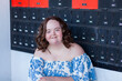 © Austockphoto - Happy young australian person with a disability at post office