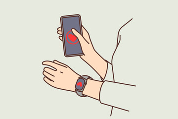 Hands of person with phone and fitness bracelet with heart to track pulse and load on cardio system 