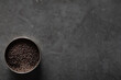 © Austockphoto - Spice tin of black mustard seeds on a dark marble background