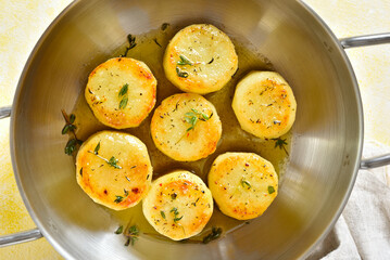 Wall Mural - Fondant potatoes in pan