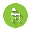 White Furniture nightstand with lamp icon isolated with long shadow background. Green circle button. Vector