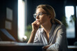 © wetzkaz - Business woman thinking in office. Generative AI