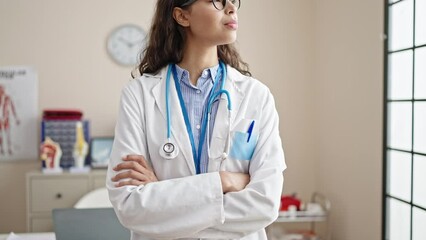 Sticker - Young beautiful hispanic woman doctor smiling confident standing with crossed arms at clinic