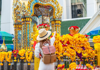 Wall Mural - Asian woman travel in erawan shrine Bangkok city