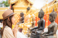 Asian Traveller Woman Travel In Wat Phrathat Doi Suthep With Buddha Statue In Chiang Mai