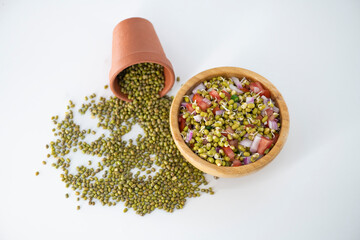 Wall Mural - Sprouting green gram bean Indian salad with Onion, coriander leaf , green chili and tomatoes. Indian sprouting gram bean salad with isolated background.