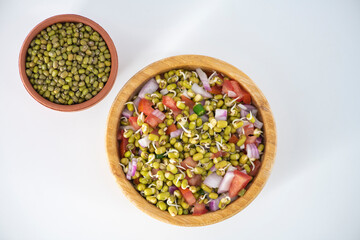 Wall Mural - Sprouting green gram bean Indian salad with Onion, coriander leaf , green chili and tomatoes. Indian sprouting gram bean salad with isolated background.