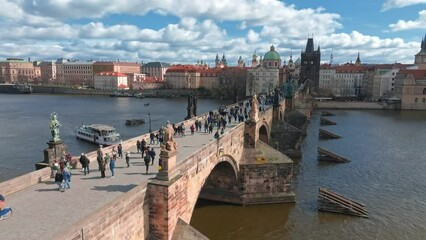 Wall Mural - Scenic spring panoramic aerial view of the Old Town pier architecture and Charles Bridge over Vltava river in Prague, Czech Republic
