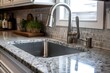 ..Clean and modern kitchen sink with subway tile backsplash.