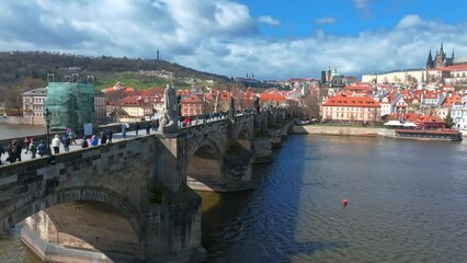 Wall Mural - Scenic spring panoramic aerial view of the Old Town pier architecture and Charles Bridge over Vltava river in Prague, Czech Republic
