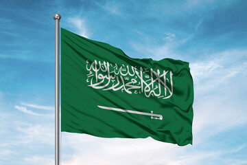 Wall Mural - Saudi Arabia national flag cloth fabric waving on beautiful sky Background.