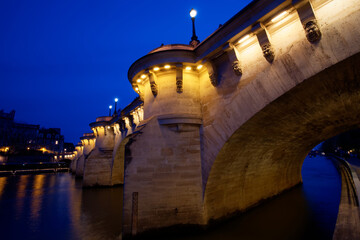 Poster - CItyscape of downtown with Pont Neuf Bridge and River Seine at night , Paris.