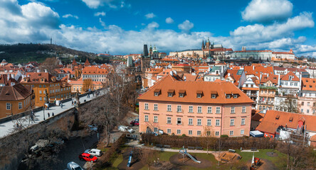 Wall Mural - Scenic spring panoramic aerial view of the Old Town pier architecture and Charles Bridge over Vltava river in Prague, Czech Republic