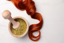 Mortar Of Henna Powder And Red Strand On White Marble Table, Flat Lay With Space For Text. Natural Hair Coloring