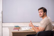 © Elnur - Young male student sitting in the classroom