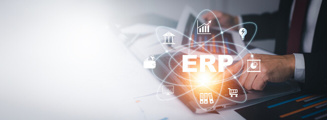 Business people using a laptop with document management for ERP. Enterprise resource planning concept,Enterprise Resource Management ERP software system for business resources plan presented.