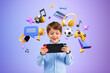 Smiling boy with console playing video games, online entertainment