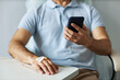 © Seventyfour - Closeup of unrecognizable man using smartphone during chemotherapy treatment, copy space