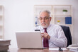 © Elnur - Old male employee and too much work in the office