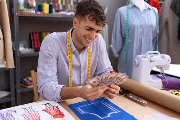 Poster - Young hispanic man tailor smiling confident counting dollars at atelier