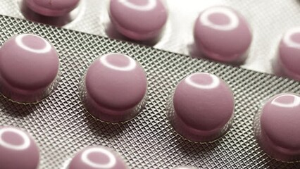 Poster - Pink tablets in blister rotate in circle