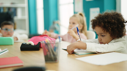 Poster - Group of kids students sitting on table studying at classroom