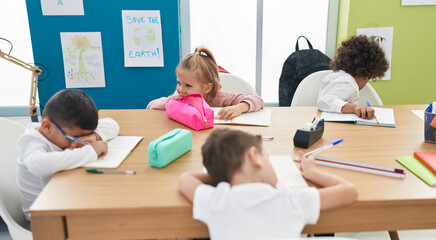 Poster - Group of kids students sitting on table studying at classroom