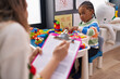 © Krakenimages.com - African american boy playing with construction blocks having psychotherapy at kindergarten