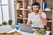 © Krakenimages.com - Young arab man army soldier using laptop and headphones at home