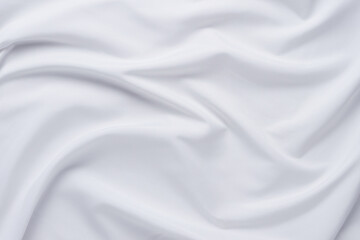 white fabric. luxurious white fabric texture background. creases of satin, silk and cotton.