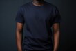 © Tuyres - Black man model wearing a plain navy blue short sleeved t-shirt, isolated on a blank background. Mock-up, torso only. Generative AI illustration.