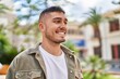 © Krakenimages.com - Young hispanic man smiling confident standing at park