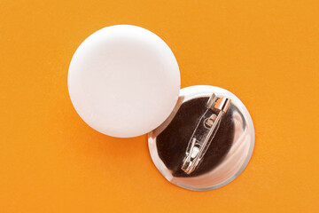 Blank white badges on orange background