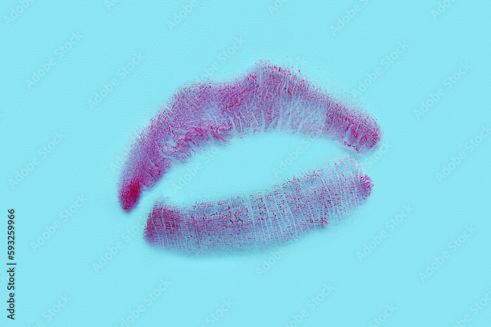 Lipstick kiss mark on blue background