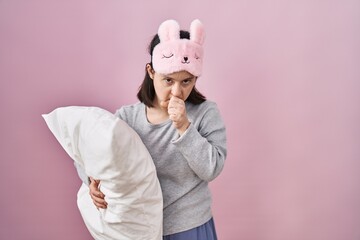 Sticker - Woman with down syndrome wearing sleeping mask hugging pillow feeling unwell and coughing as symptom for cold or bronchitis. health care concept.