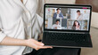 © golubovy - E-learning class. Video conference. Digital education. Female coach showing diverse students group working online on laptop screen.