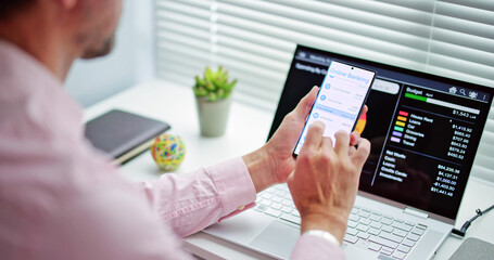 Businessman Using Online Banking Service On Phone