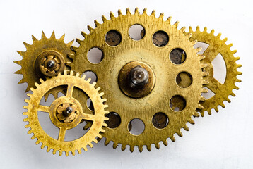 Wall Mural - Gears on a white background. Gears from old clocks on white. Background for design on the theme of industry, steampunk, antiquity, etc.