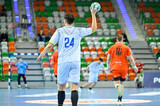 Handball player with ball during handball match.