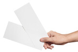 Fototapeta  - Male hand holding two blank sheets of paper (tickets, flyers, invitations, coupons, banknotes, etc.), cut out