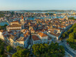Aerial shot of magnificent Venetian city on the Adriatic Sea - Trogir, Croatia. Morning shot of old town Trogir with orange tiled roofs