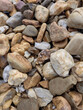 Decorative stones for the garden in shades of beige and brown.
