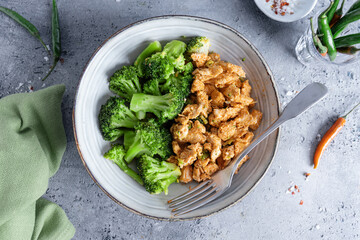 Canvas Print - Chicken breast chunks with vegetables on plate