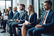 © VisualProduction - Photo of candidates waiting for a job interview. Waiting room, sitting in line. Business clothing, corporate environment. Generative AI.