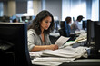© aicandy - Focused technical writer in a busy newsroom, surrounded by monitors and stacks of papers, typing quickly on her computer with a look of determination on her face, generative ai