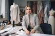 © aicandy - Portrait of a young and ambitious fashion designer, full of passion and creativity, working tirelessly on her first collection, generative ai