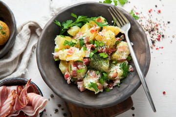 Kartoffelsalat - traditional German potato salad. Potato salad with bacon.