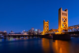 Fototapeta Krajobraz - A view of Tower Bridge in Sacramento, CA from River Walk Park at dusk
