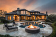 © Kien - Stunning luxury home exterior with large covered patio, outdoor fire pit, and large swimming pool, generative AI