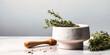 thyme, rosemary and pestle and mortar on a white background,